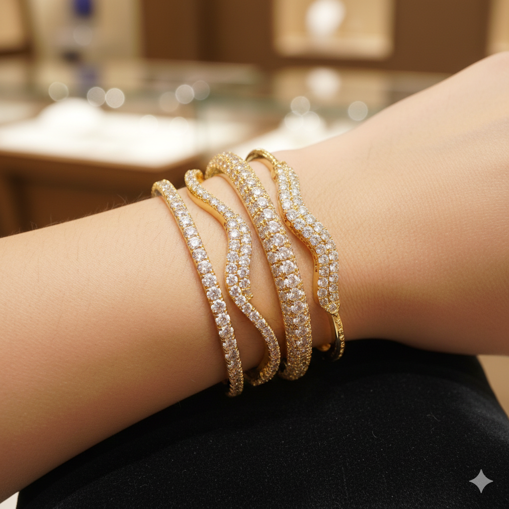 PBD Luxury Jewellery gold diamond bangles with shimmering wavy design on wrist.