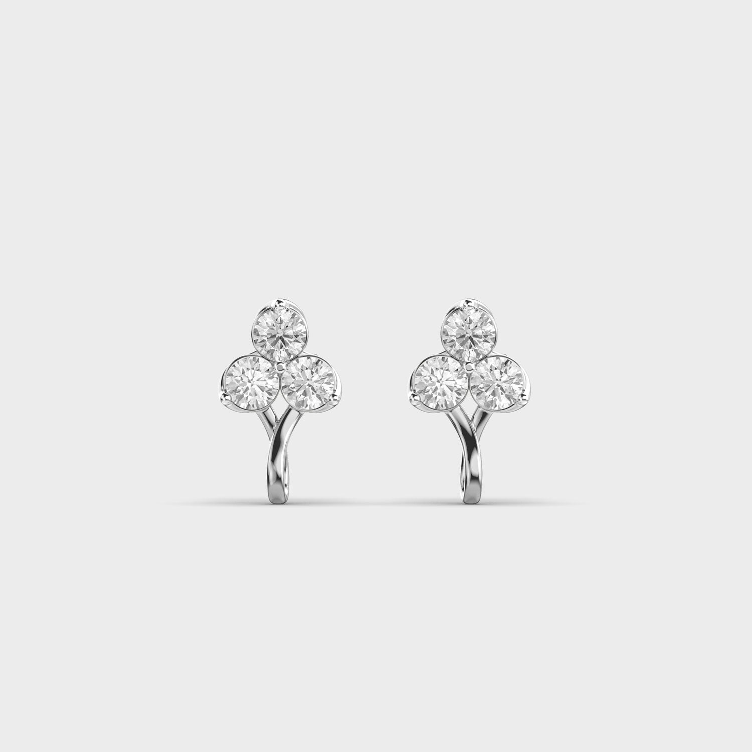 TriBloom three-stone diamond earrings in white gold, front view showcasing round EF-color VVS diamonds.