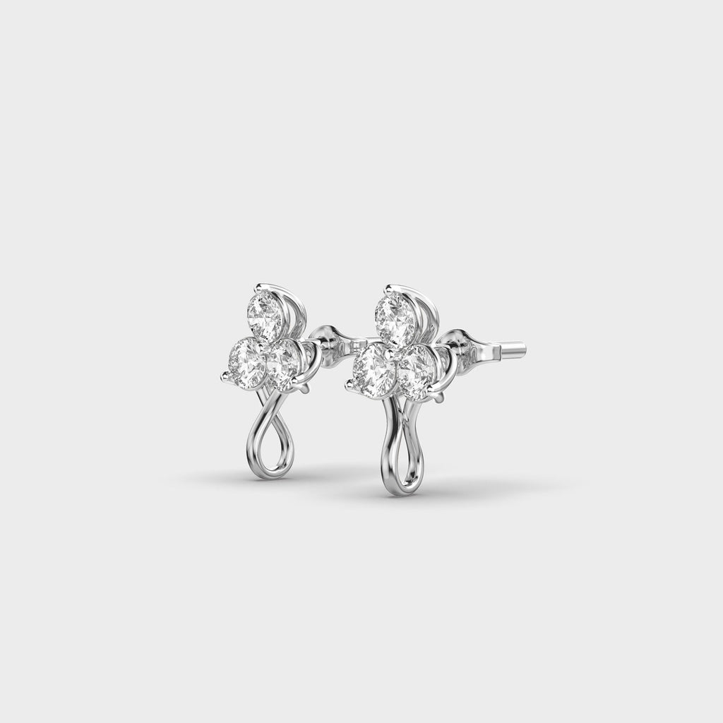 Side profile of white gold TriBloom diamond earrings showing the elegant curve and secure setting.