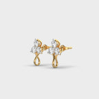 Side angle of yellow gold floral diamond earrings showcasing the smooth finish and raised cluster setting.