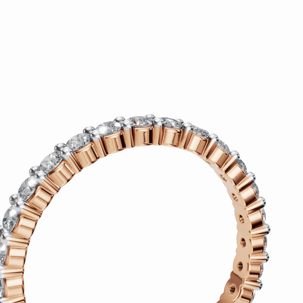 Macro shot of rose gold full eternity band showing fine craftsmanship and high-clarity diamonds.