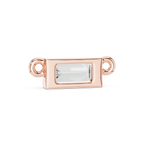 Rose gold jewelry clasp with a clear gemstone on a white background