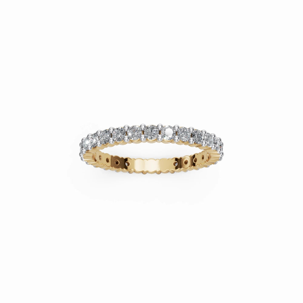 Flat lay of yellow gold eternity ring with bright reflections and full diamond circle.
