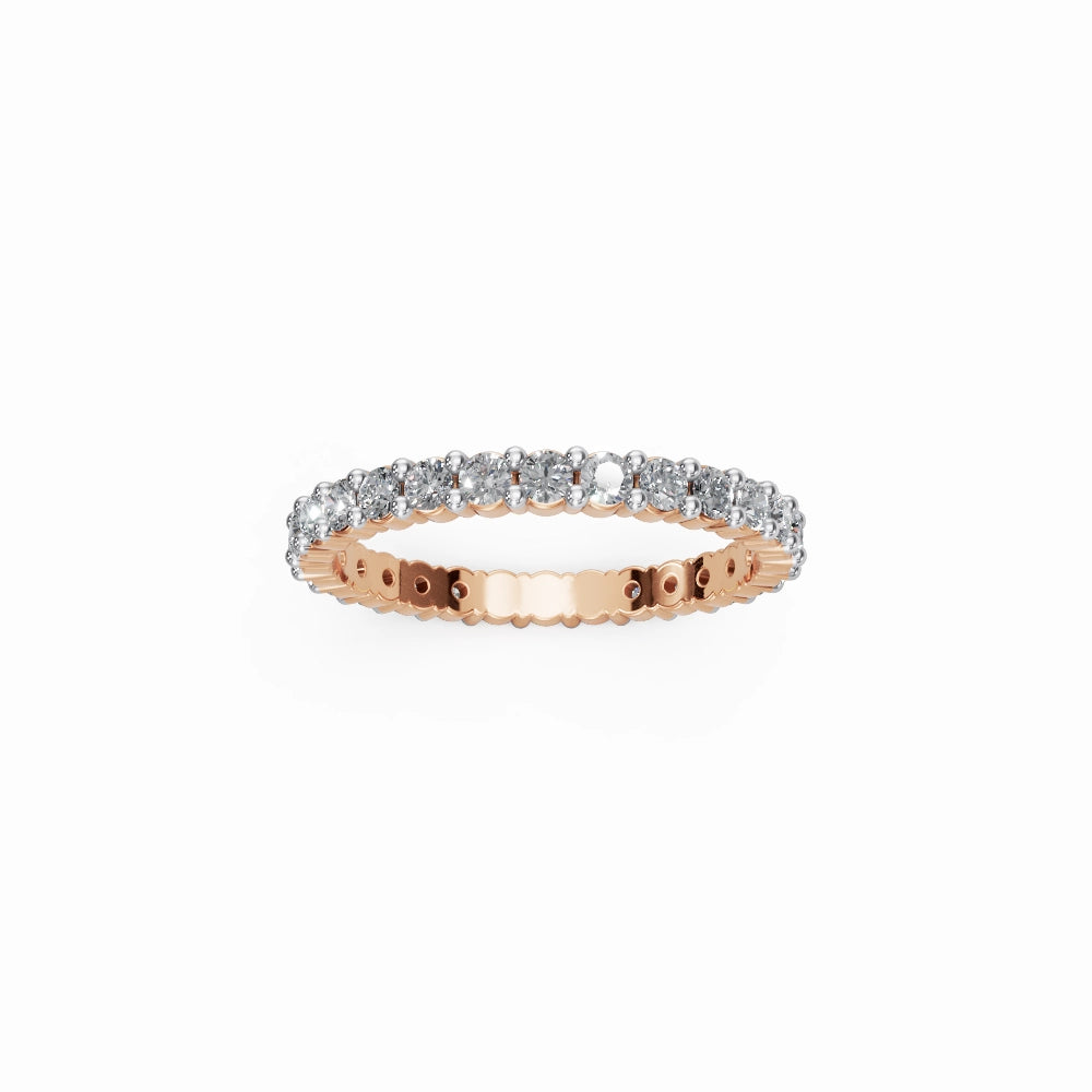 Soft rose gold eternity band featuring warm pink tones and sparkling F–G VVS/VS diamonds.