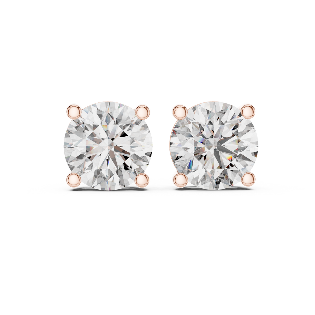 Round diamond stud earrings in rose gold showing an angled front view with four-prong basket setting and brilliant round lab grown diamonds