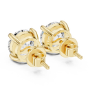 Rear top view of yellow gold diamond stud earrings revealing open gallery basket design and polished gold finish
