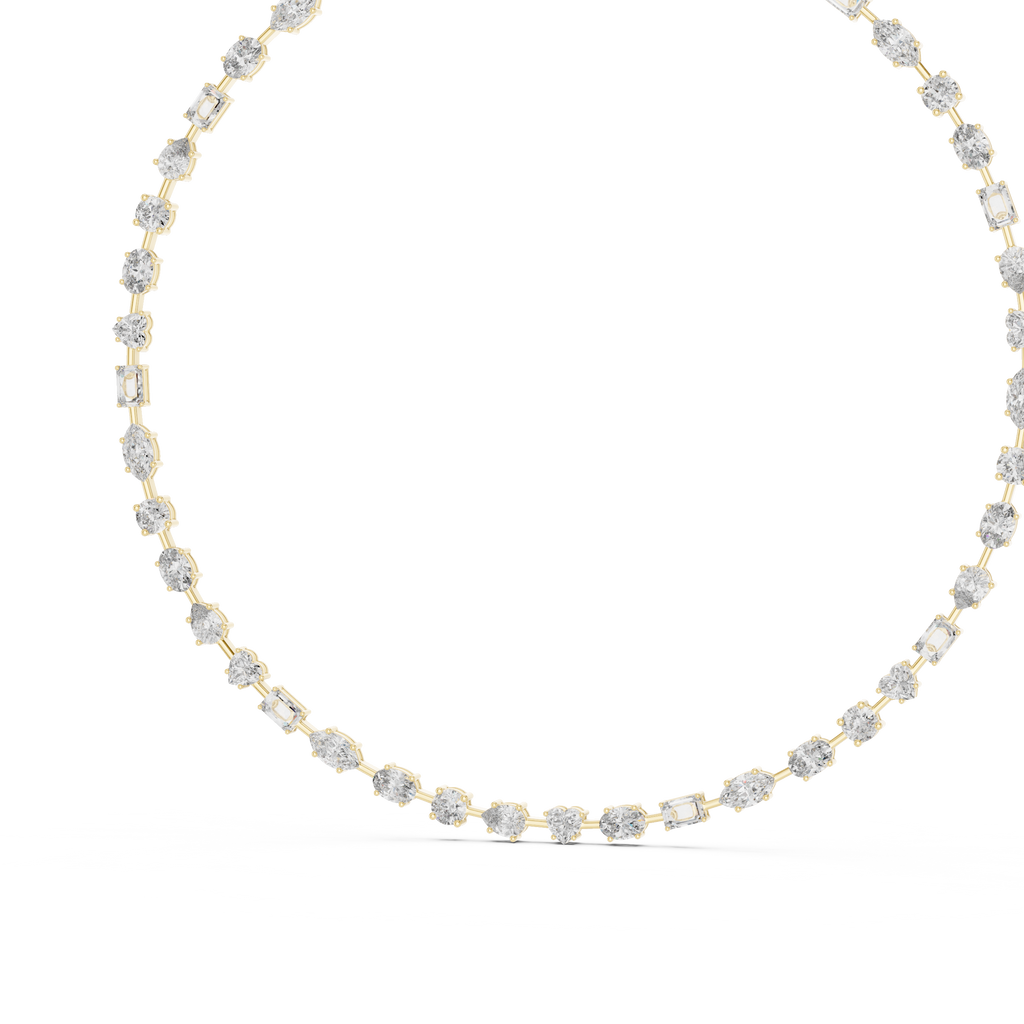 Gold necklace with clear stones on a white background