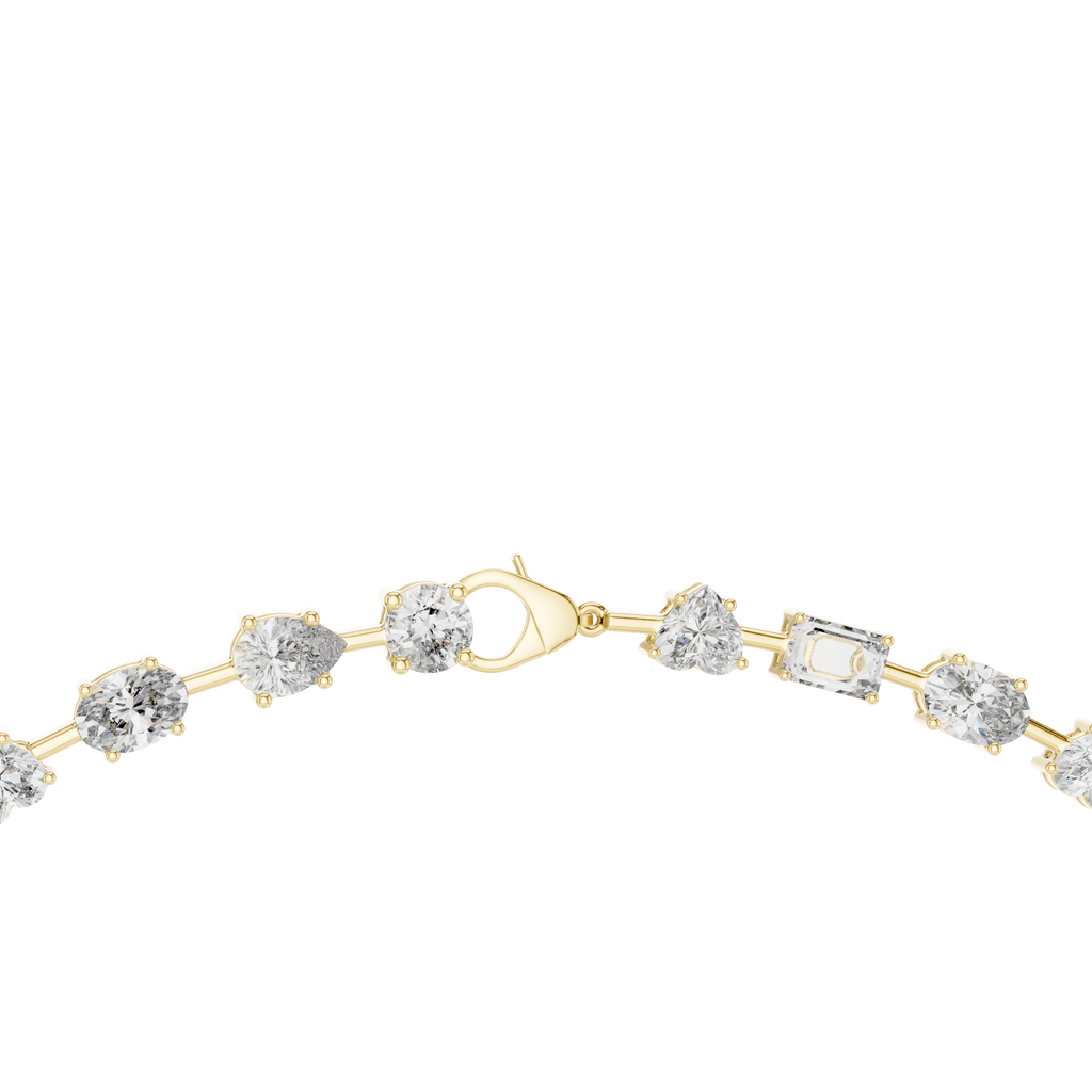 Close-up front view of mixed shape diamond necklace in yellow gold featuring round, oval, marquise, heart, emerald and pear diamonds in collet settings