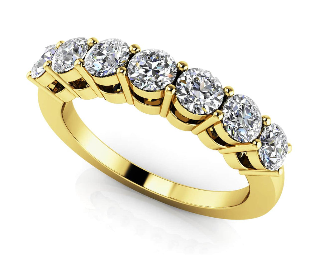 Gold ring with diamonds on a white background