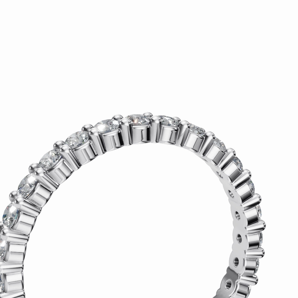 Ultra close-up of white gold full eternity diamond band showing clarity, shine, and polished detailing.