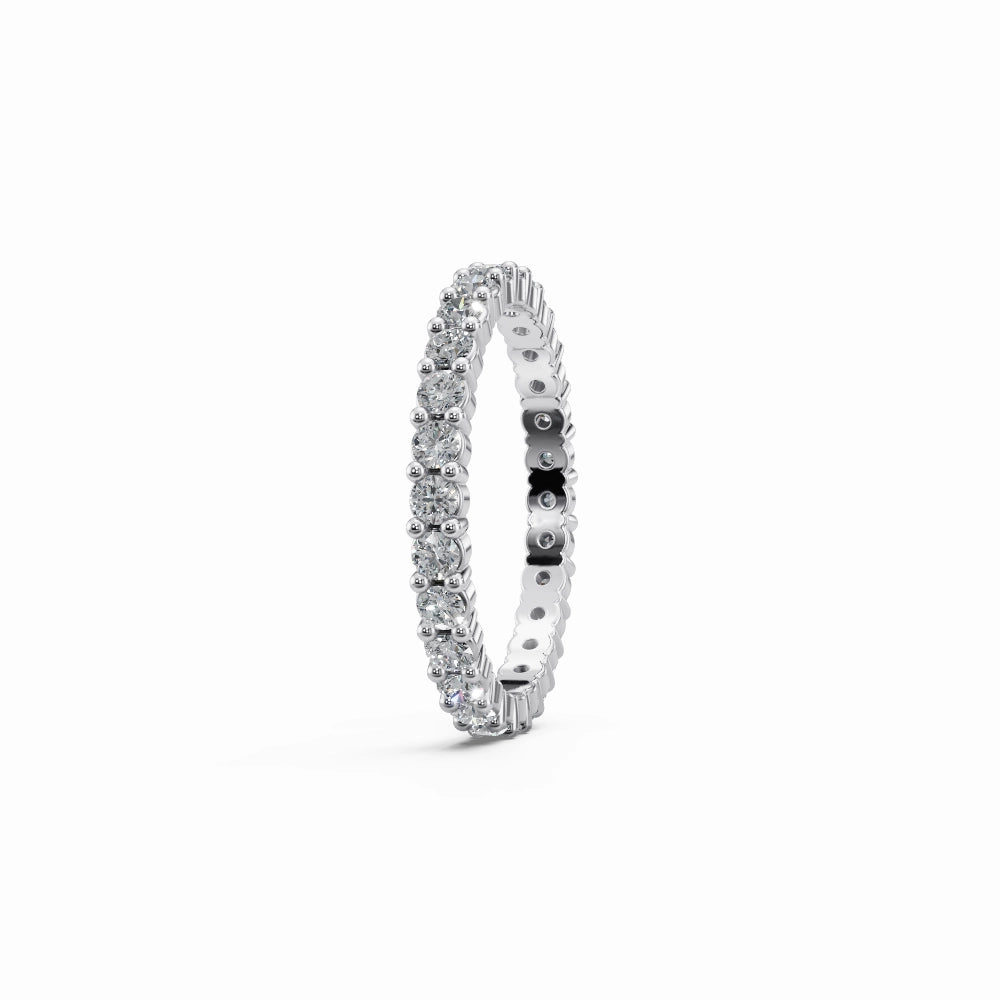 Clean white gold eternity ring side view showing modern, sleek setting and full diamond coverage.