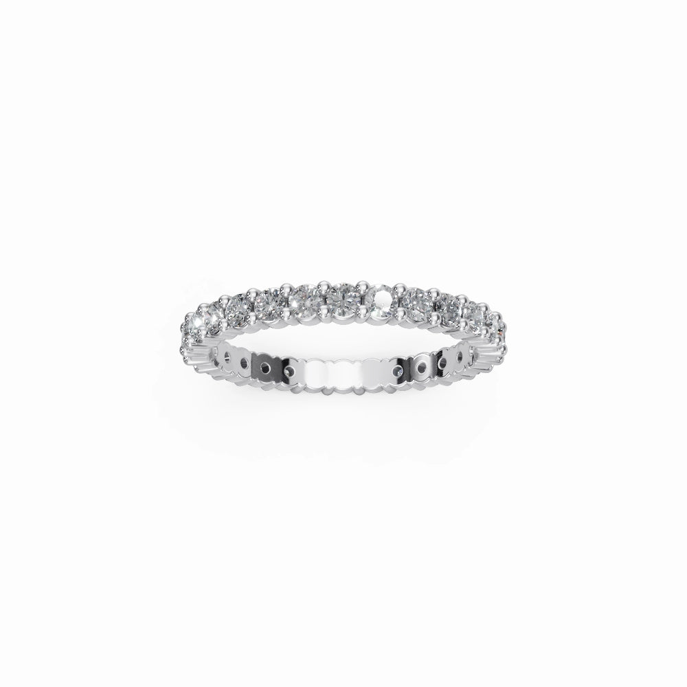 White gold full eternity ring displayed flat with bright reflections and icy white brilliance.