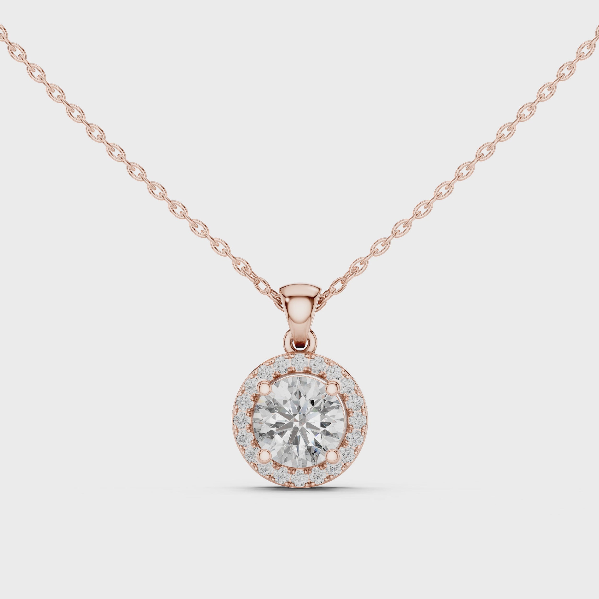 360 degree video view of rose gold round diamond halo pendant from all angles