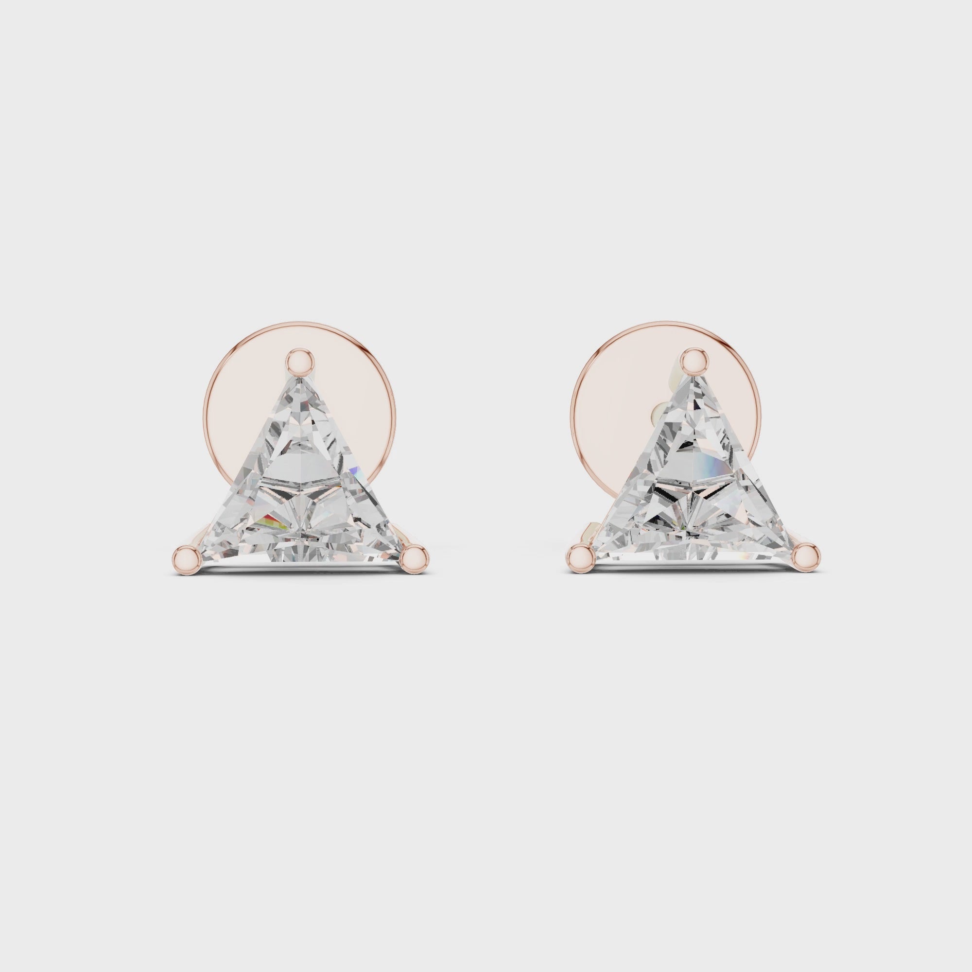 360 degree rotating video of trillion cut diamond stud earrings in rose gold