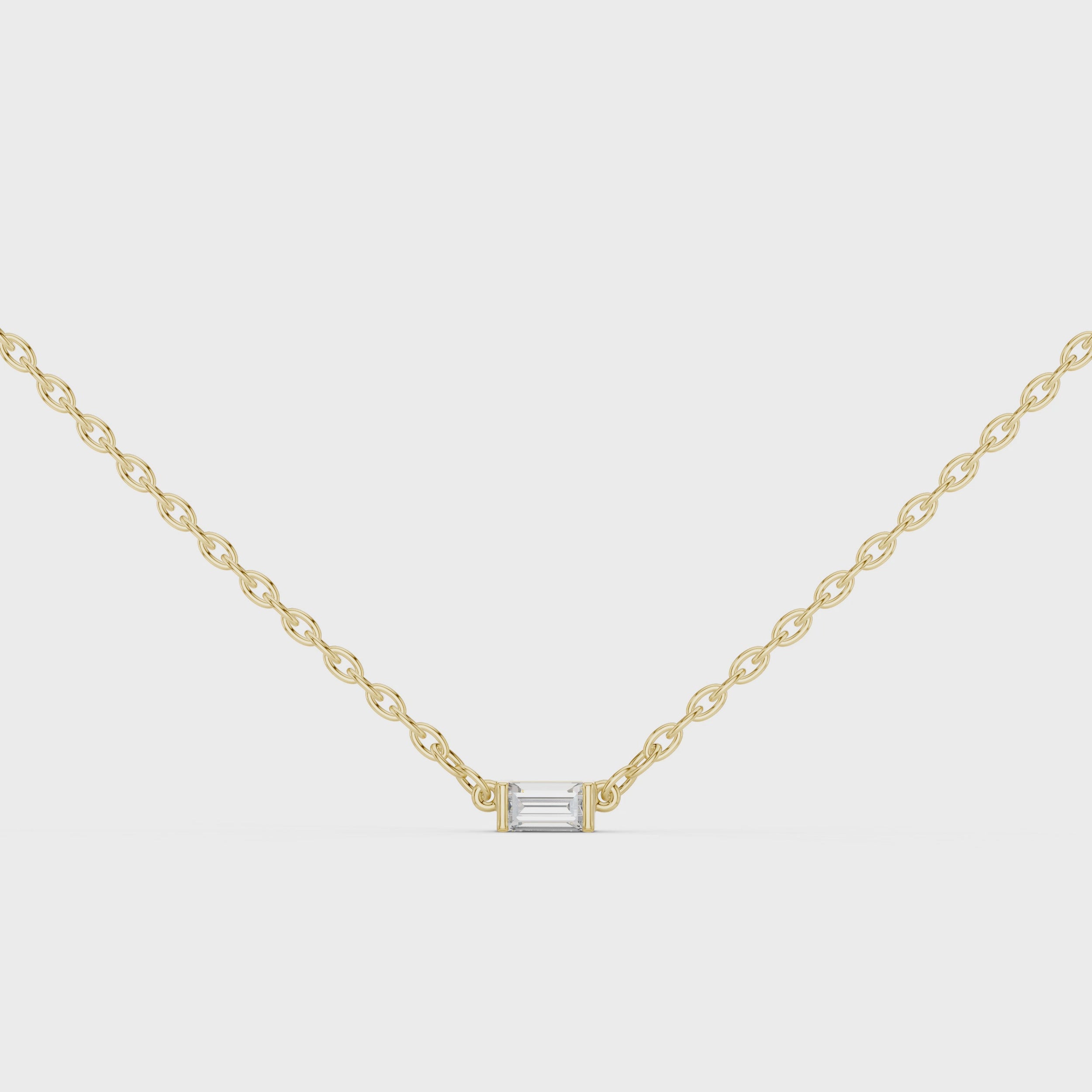 360 degree view of Linea baguette diamond pendant in yellow gold with refined linear design and brilliance