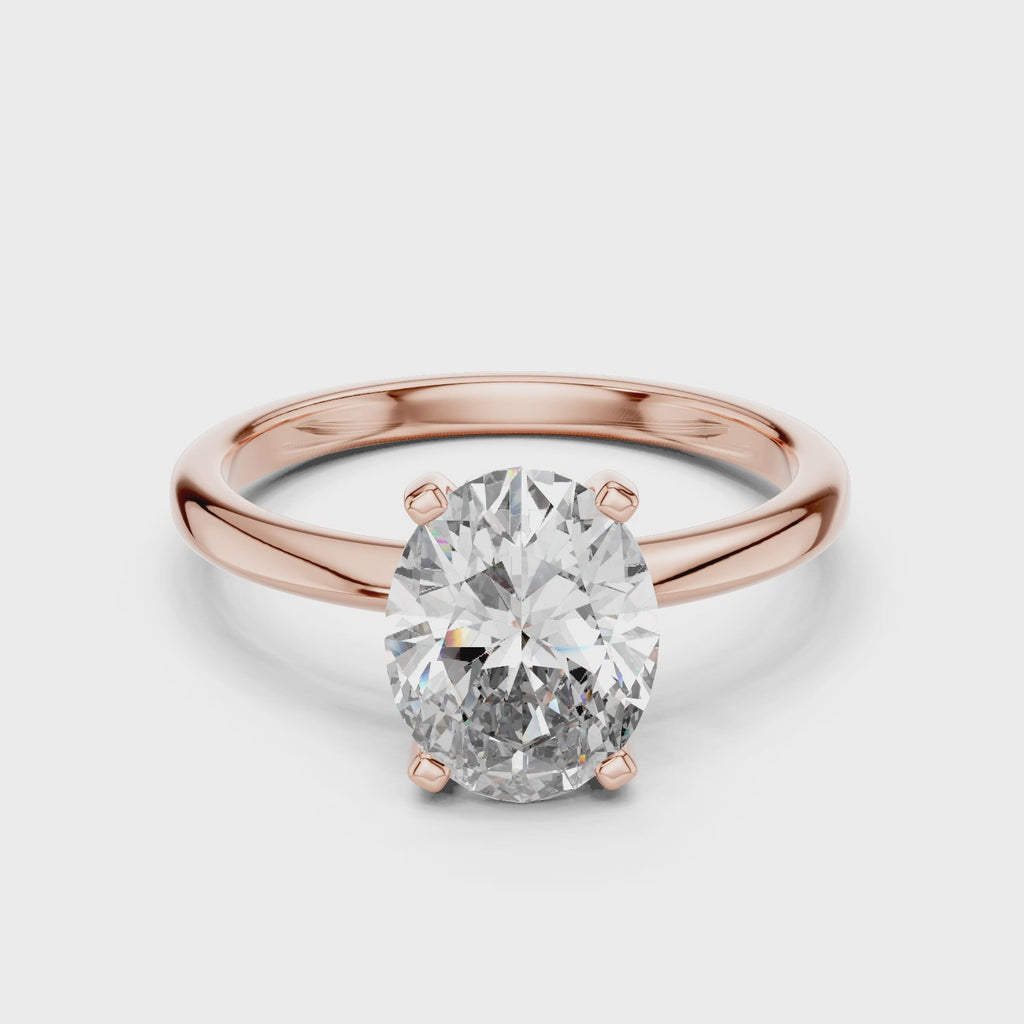 360-degree view of oval solitaire diamond ring in rose gold, highlighting warm tone and sparkling center stone