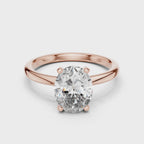 360-degree view of oval solitaire diamond ring in rose gold, highlighting warm tone and sparkling center stone