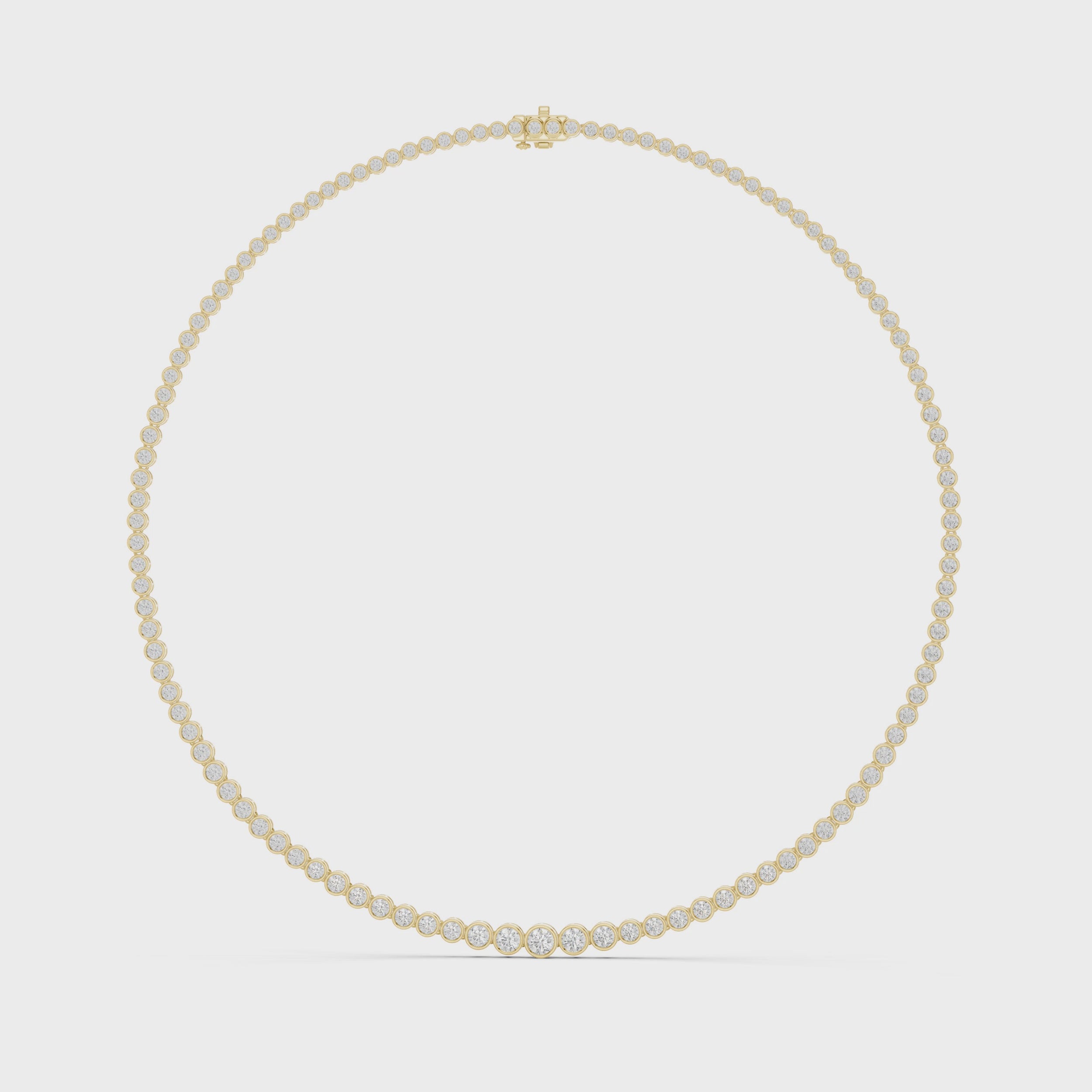 360 degree rotating video of graduated bezel diamond tennis necklace crafted in yellow gold
