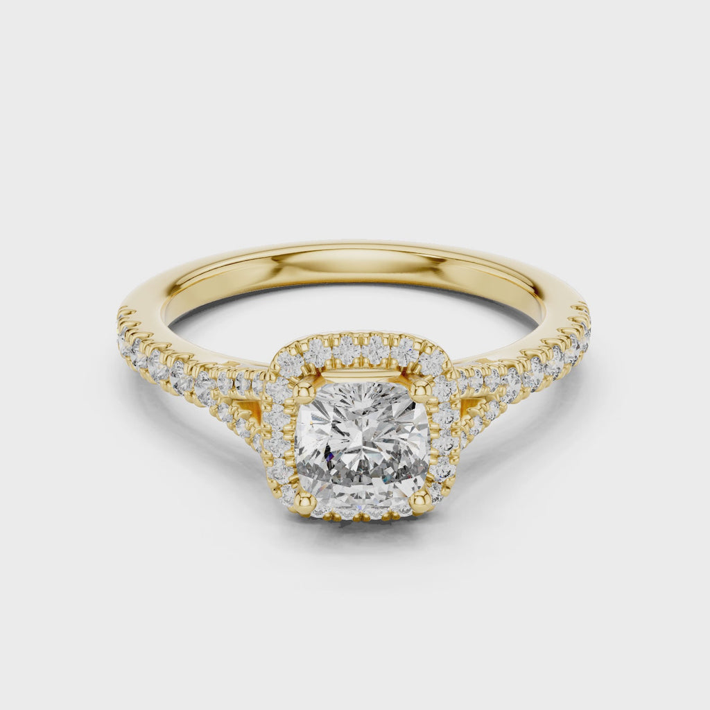 Yellow gold cushion halo solitaire ring with brilliant cushion cut diamond center