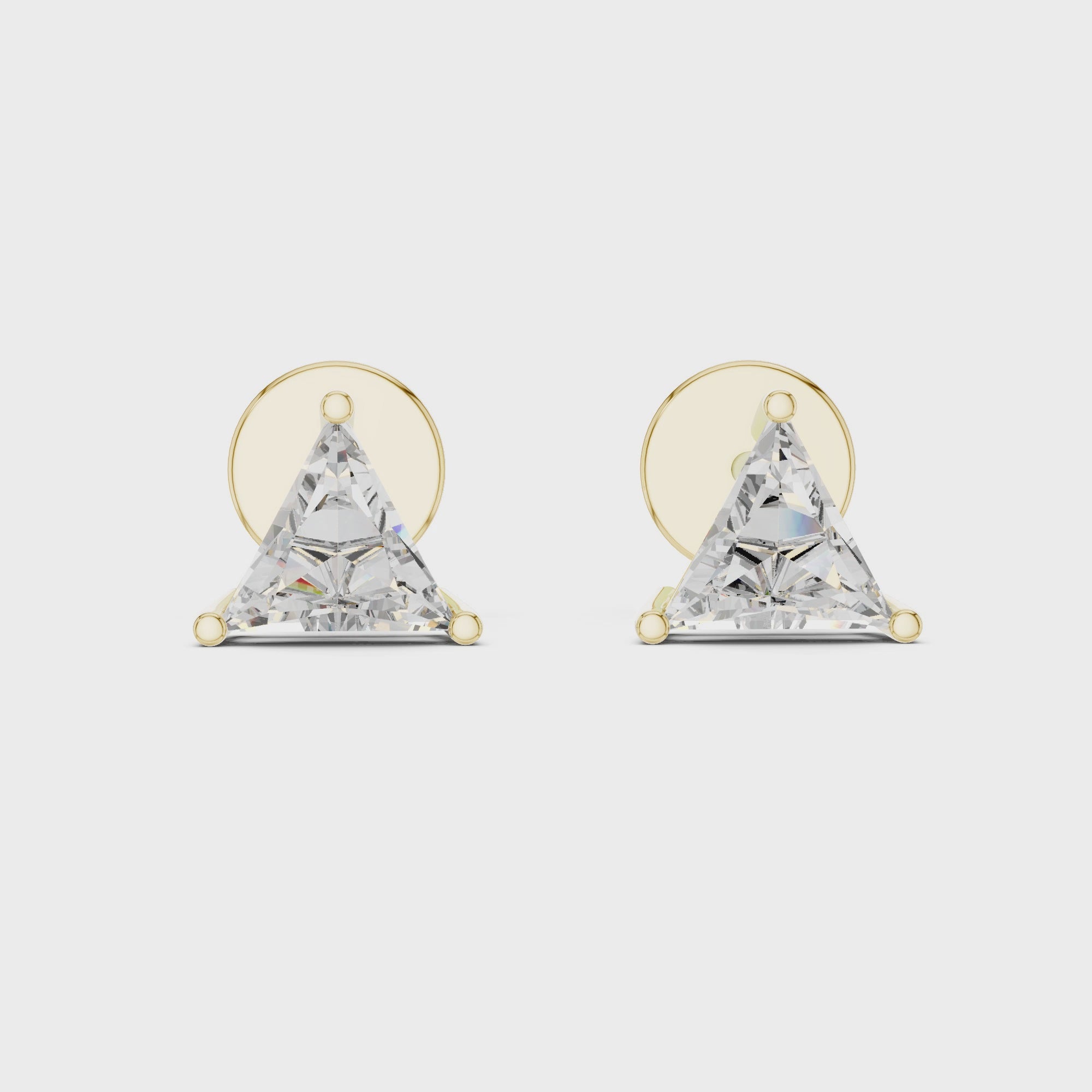 360 degree rotating view of trillion cut diamond stud earrings in yellow gold