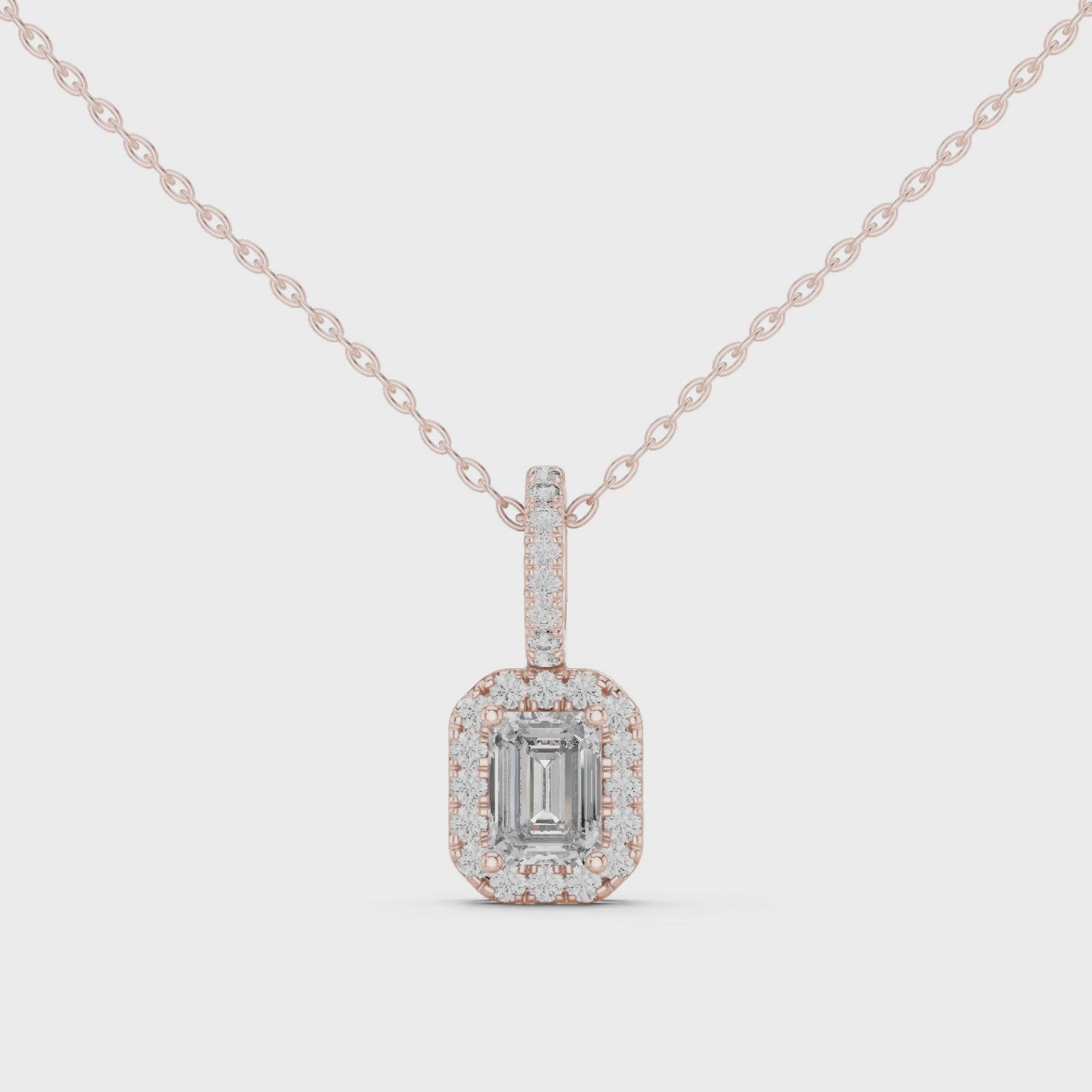 360 view emerald halo diamond pendant in rose gold