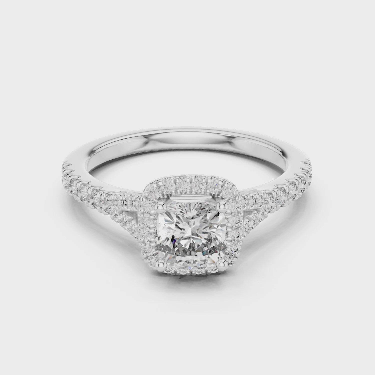Cushion halo solitaire diamond ring crafted in white gold with pavé diamond band