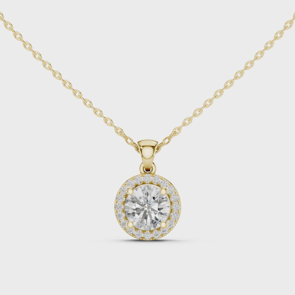 360 degree rotating video of round diamond halo pendant in yellow gold finish