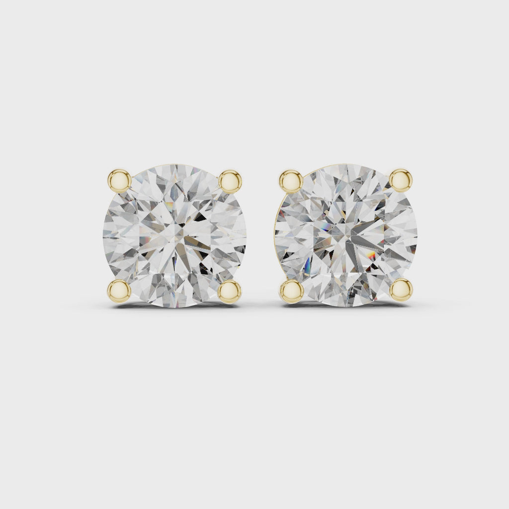 360 degree product video of yellow gold round diamond stud earrings highlighting sparkle, setting details, and overall craftsmanship
