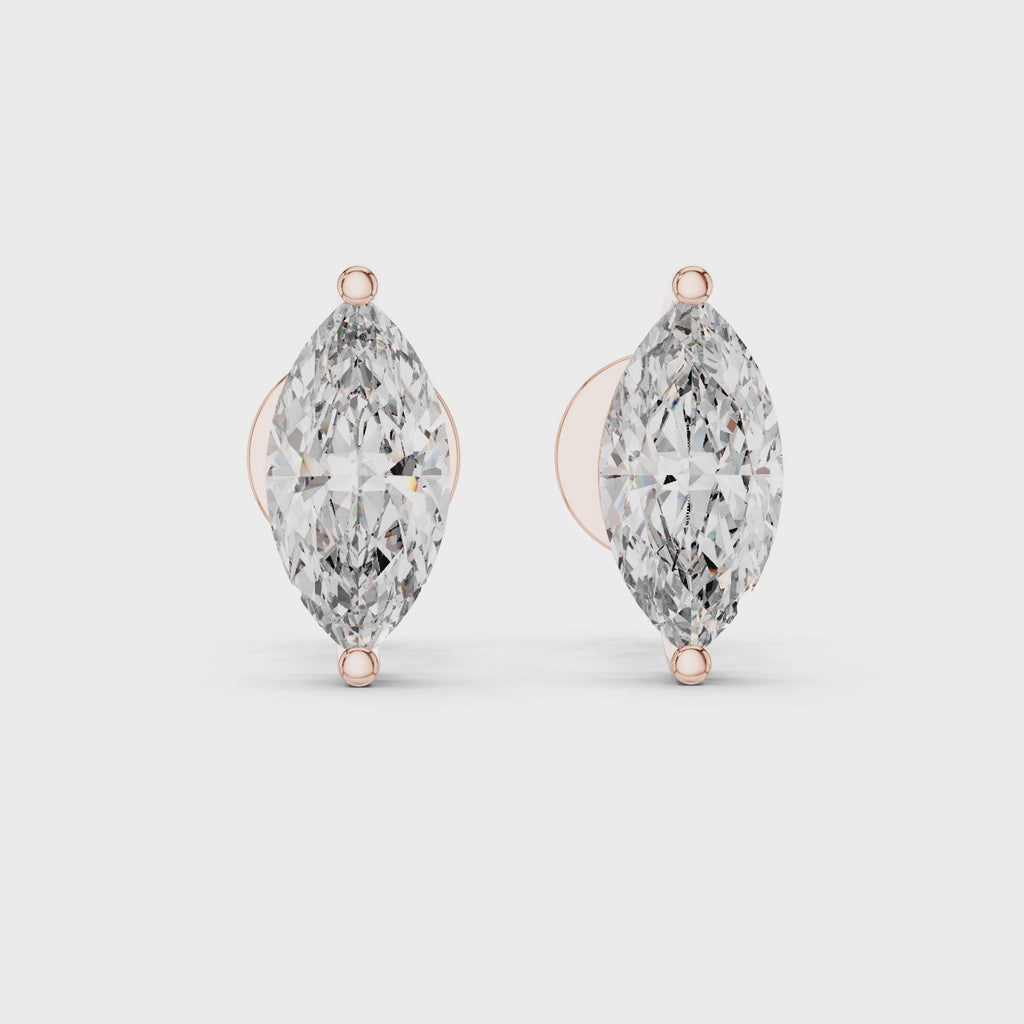 360 degree rotating video of rose gold marquise solitaire diamond stud earrings displaying complete design from every angle