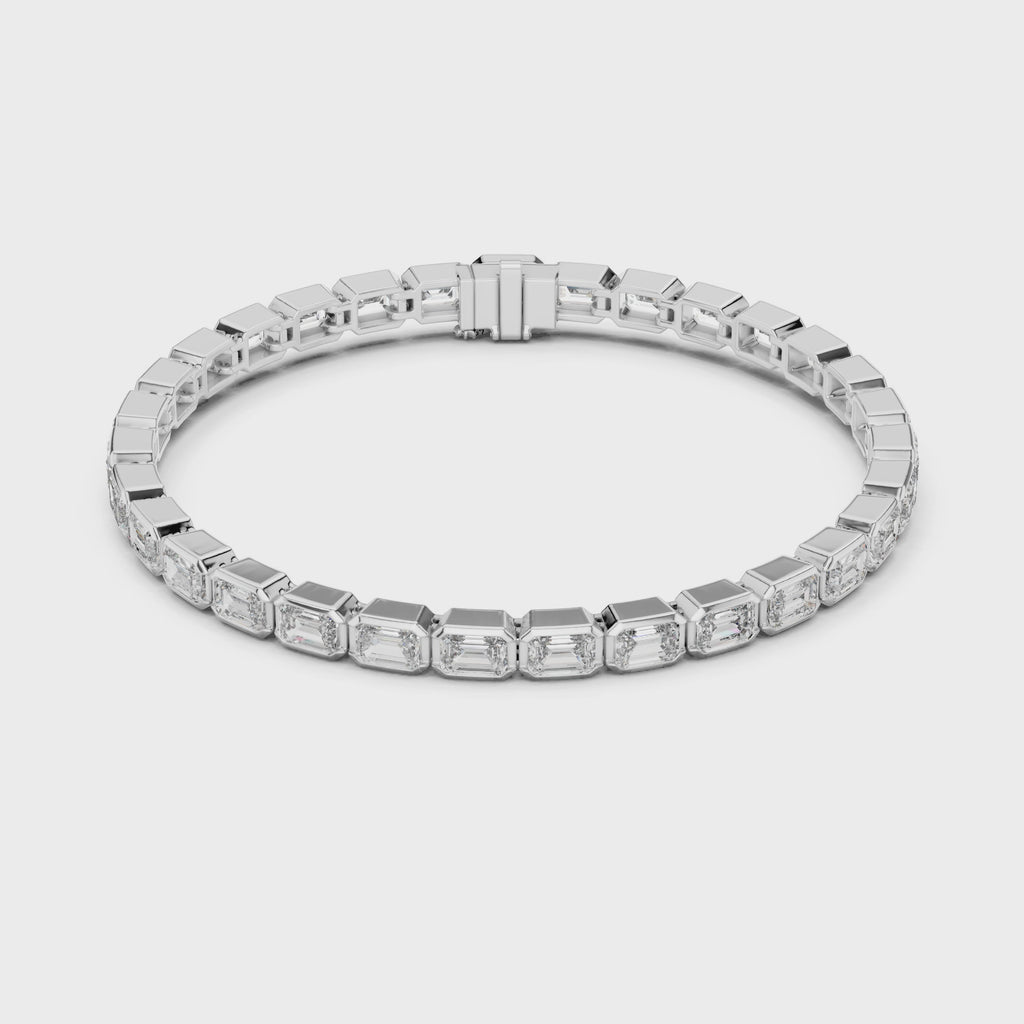360 degree view video of white gold emerald bezel diamond tennis bracelet displaying full bracelet design and secure clasp