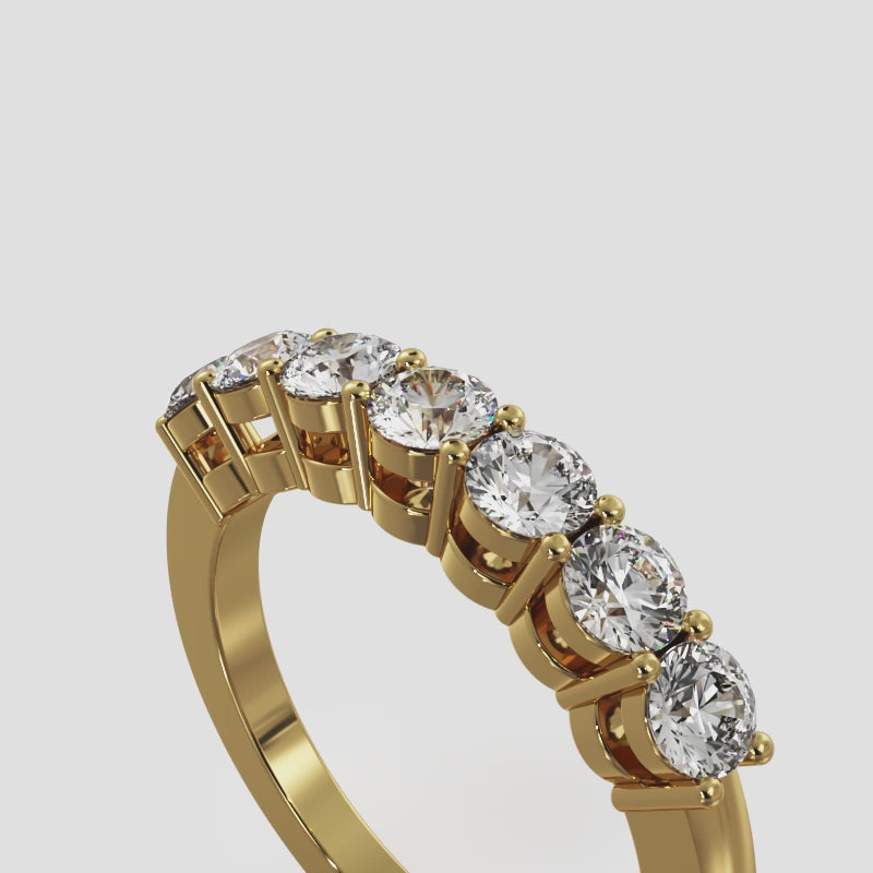Yellow gold 7-stone half eternity ring rotating on a white background, showing full diamond sparkle, band details, and craftsmanship from all angles.