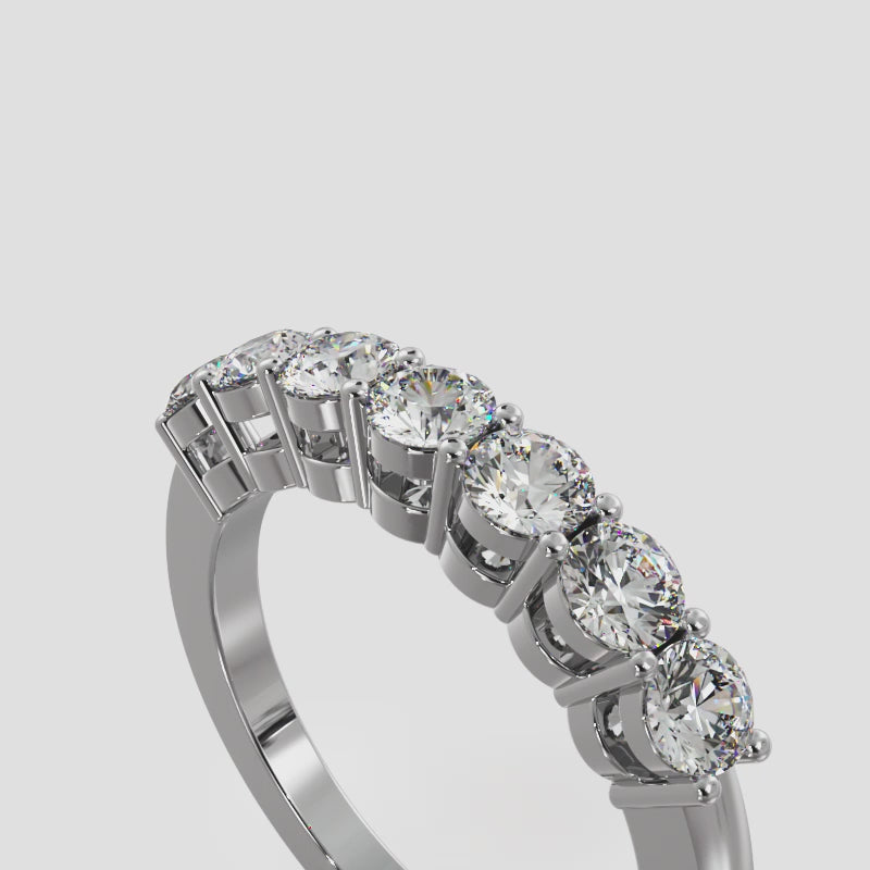 White gold 7-stone half eternity ring rotating on a white background, showing full diamond sparkle, band details, and craftsmanship from all angles.