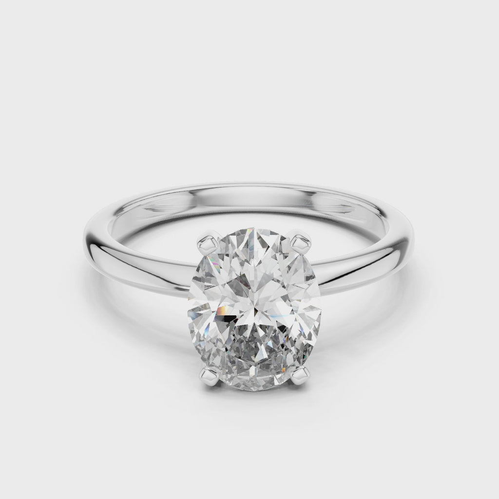 Full rotation view of oval solitaire ring in white gold showcasing elegant design and diamond brilliance