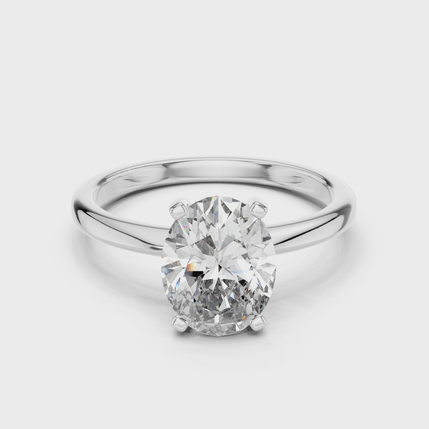 Full rotation view of oval solitaire ring in white gold showcasing elegant design and diamond brilliance