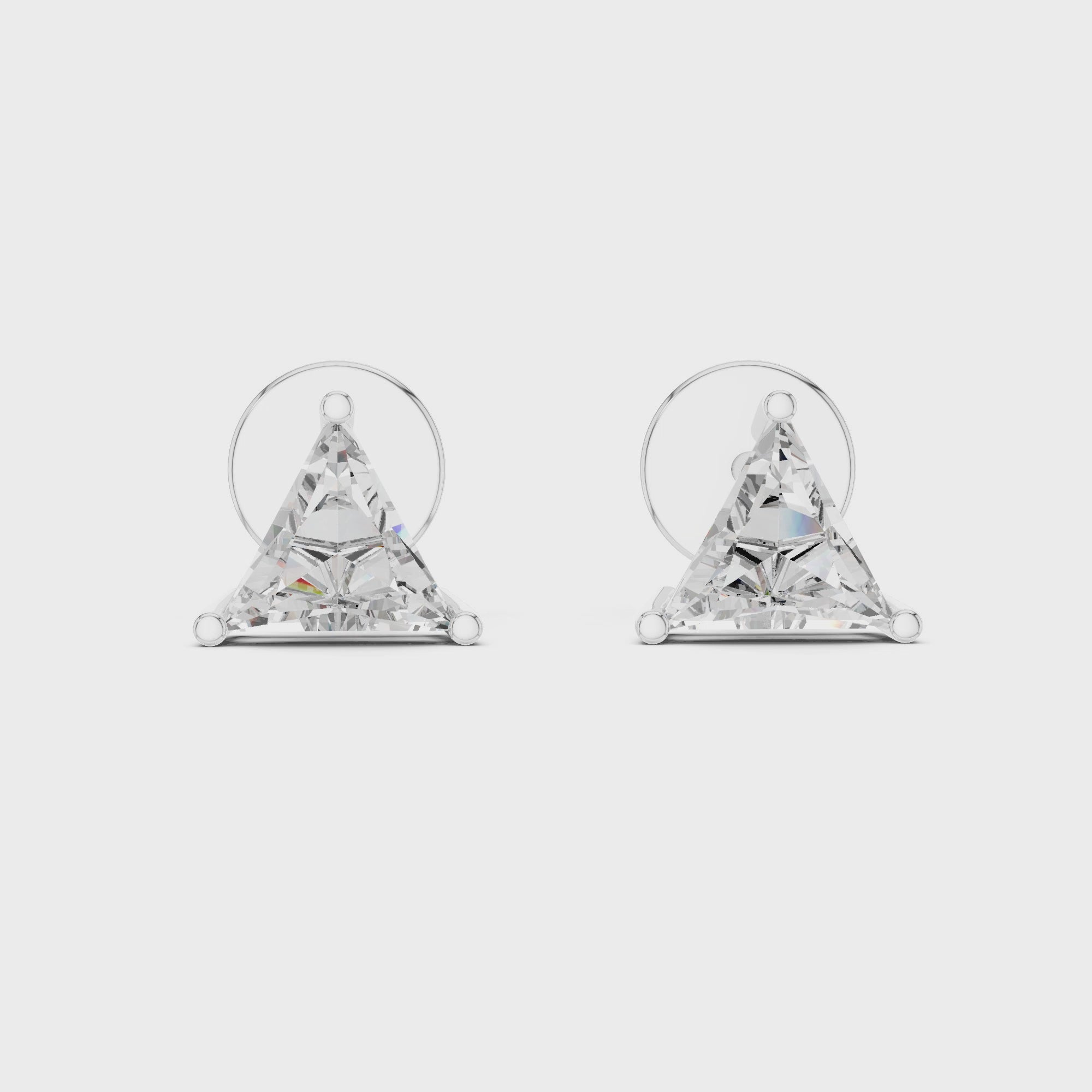 360 degree rotating video of trillion cut diamond stud earrings in white gold